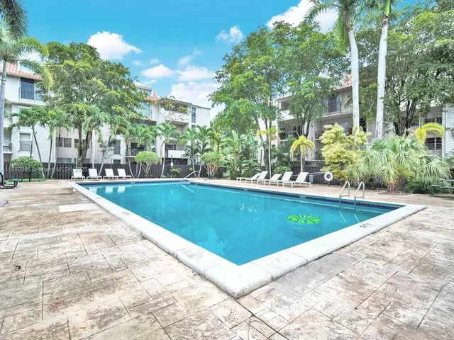 a view of swimming pool with chairs