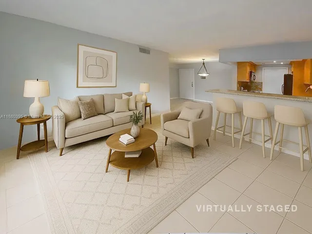 a living room with furniture and a lamp