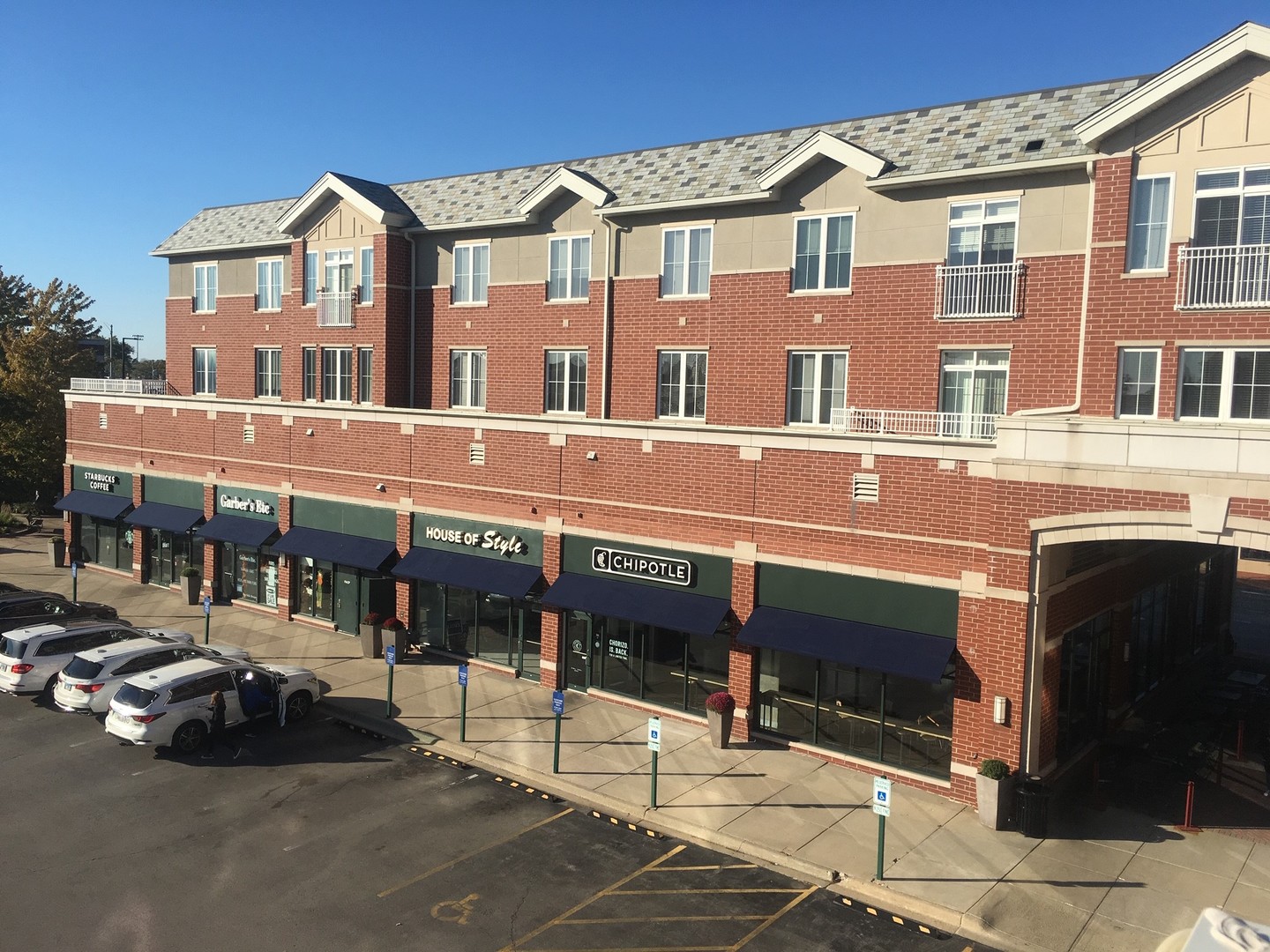 625 Deerfield Road, Unit 315 Deerfield, IL 60015 - Photo 1 of 8 a front view of a building with parking space