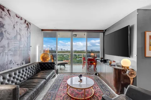a room with furniture and a flat screen tv