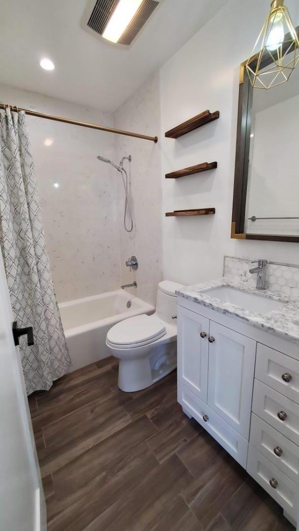 161 Laurel Avenue Millbrae, CA 94030 - Photo 14 of 24 a bathroom with a sink and a mirror