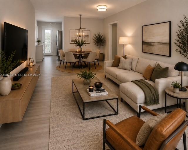 3530 Southwest 9th Terrace, Unit 6B Miami, FL 33135 - Photo 1 of 9 a living room with furniture and a flat screen tv