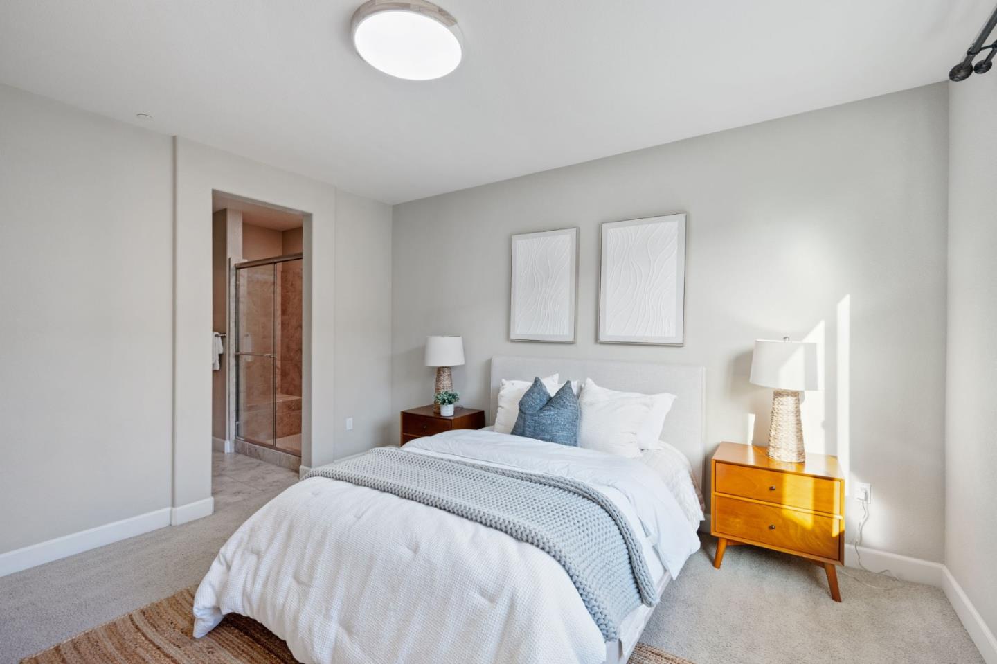 5977 Larkstone Loop San Jose, CA 95123 - Photo 30 of 63 a bedroom with a bed and a lamp