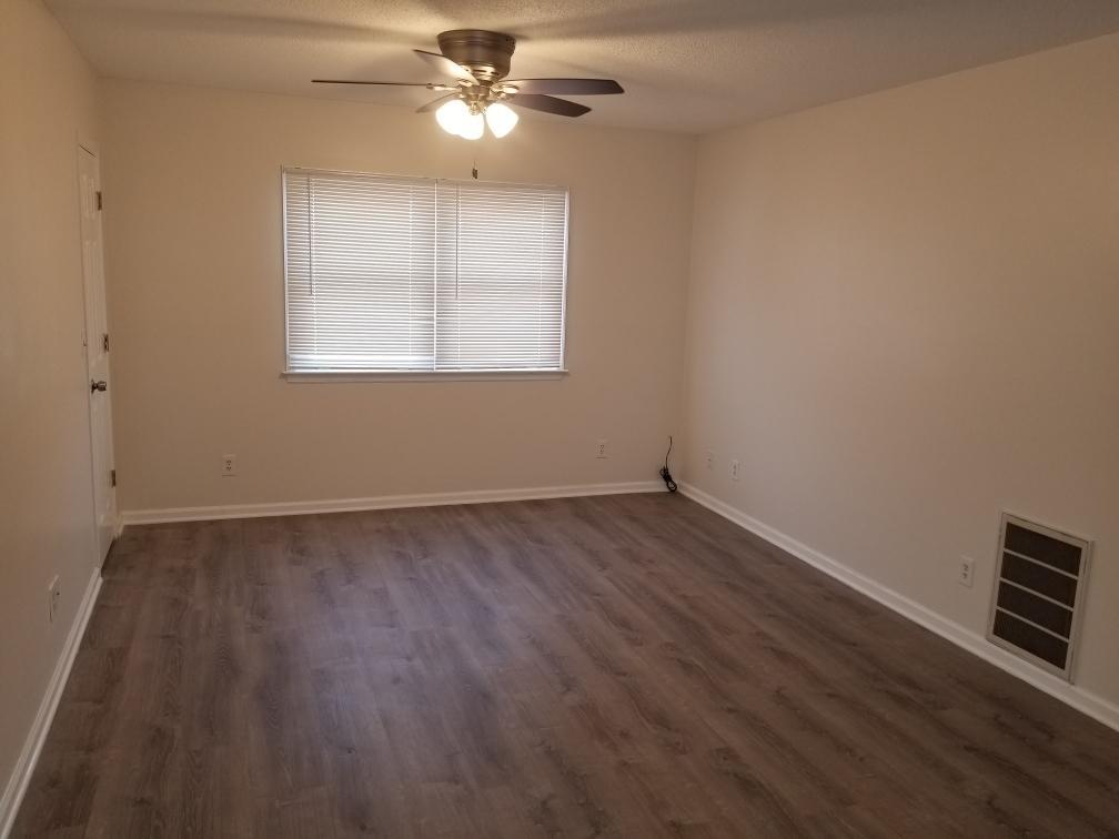 918 6th Street, Unit 3 LaSalle, IL 61301 - Photo 3 of 4 wooden floor in an empty room with a window