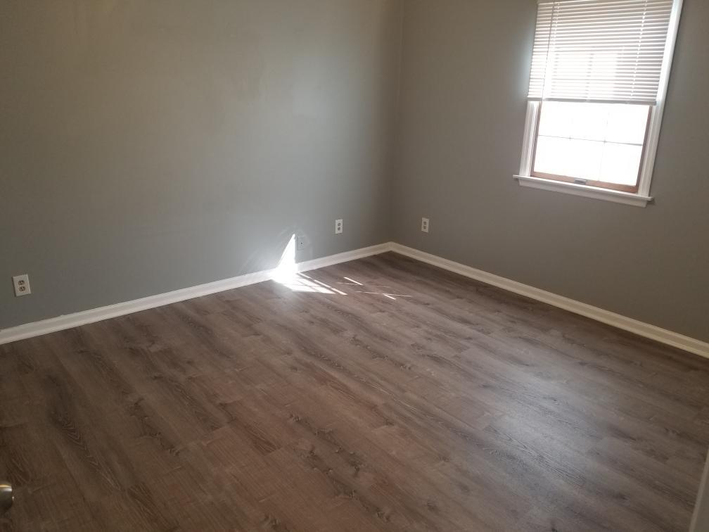 918 6th Street, Unit 3 LaSalle, IL 61301 - Photo 4 of 4 an empty room with wooden floor and windows