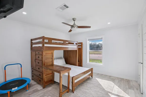 a bedroom with furniture and window