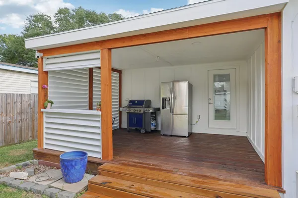 a view of a porch with seating space