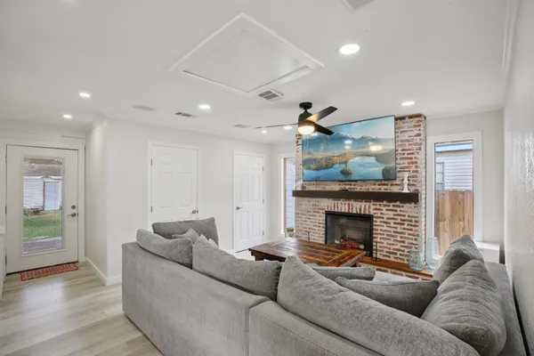 a living room with furniture and a fireplace