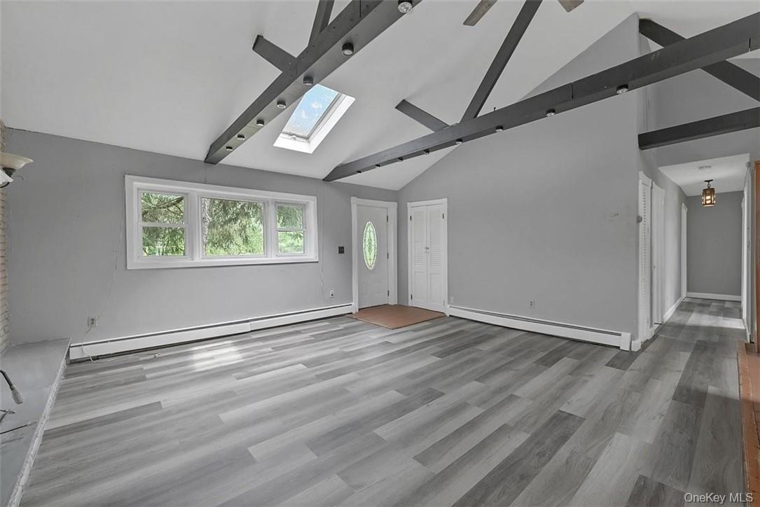 35 Peddler Hill Road Monroe, NY 10950 - Photo 4 of 23 a view of an empty room with wooden floor and a window