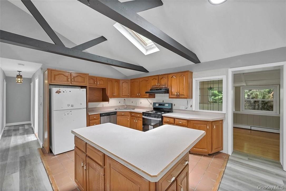 35 Peddler Hill Road Monroe, NY 10950 - Photo 7 of 23 a kitchen with sink a refrigerator and wooden floors