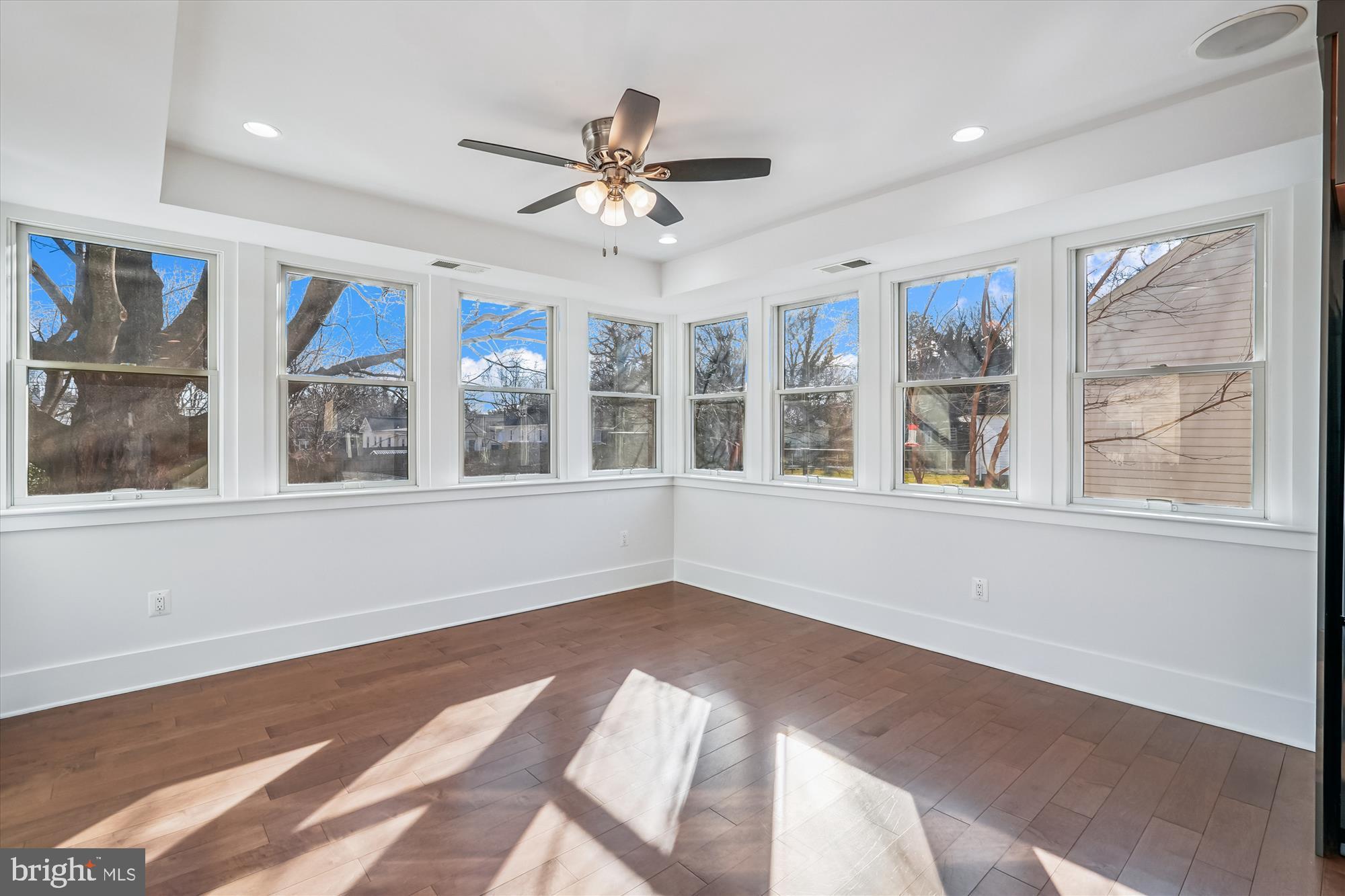 104 Pershing Avenue Northwest Leesburg, VA 20176 - Photo 12 of 36 a view of an empty room with a window and wooden floor