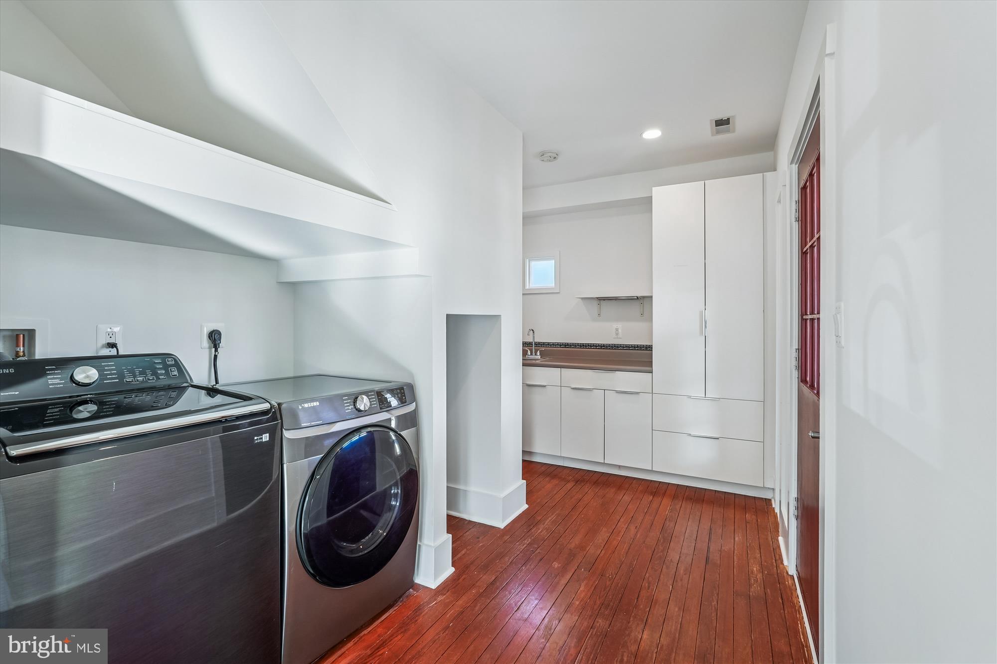 104 Pershing Avenue Northwest Leesburg, VA 20176 - Photo 14 of 36 a kitchen with a refrigerator and a stove top oven