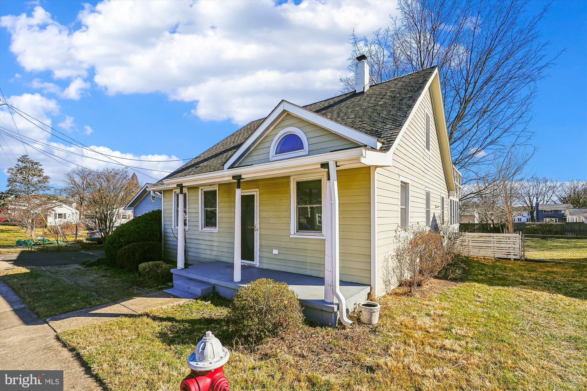 104 Pershing Avenue Northwest Leesburg, VA 20176 - Photo 2 of 36 a front view of a house with garden