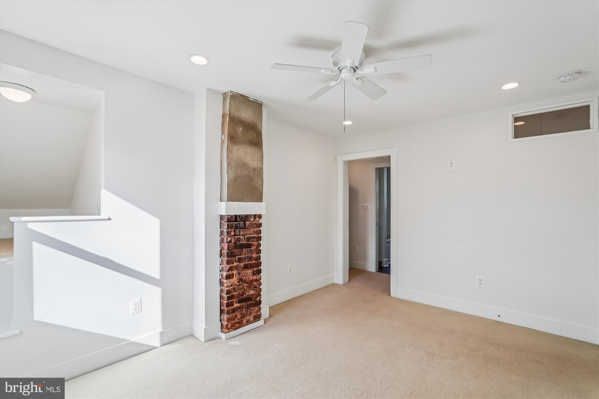 104 Pershing Avenue Northwest Leesburg, VA 20176 - Photo 26 of 36 an empty room with staircase and white walls