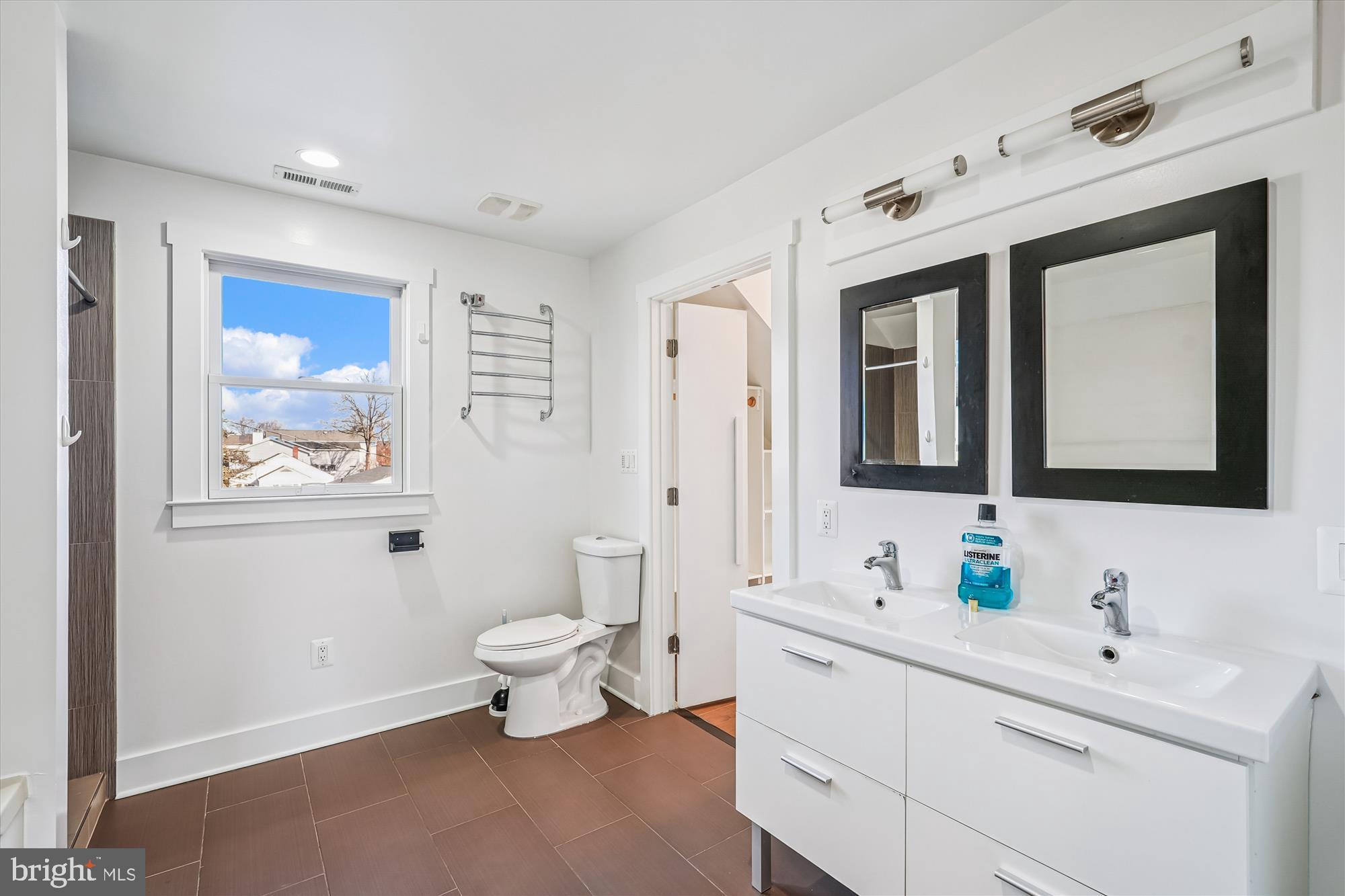 104 Pershing Avenue Northwest Leesburg, VA 20176 - Photo 27 of 36 a bathroom with a toilet sink and mirror