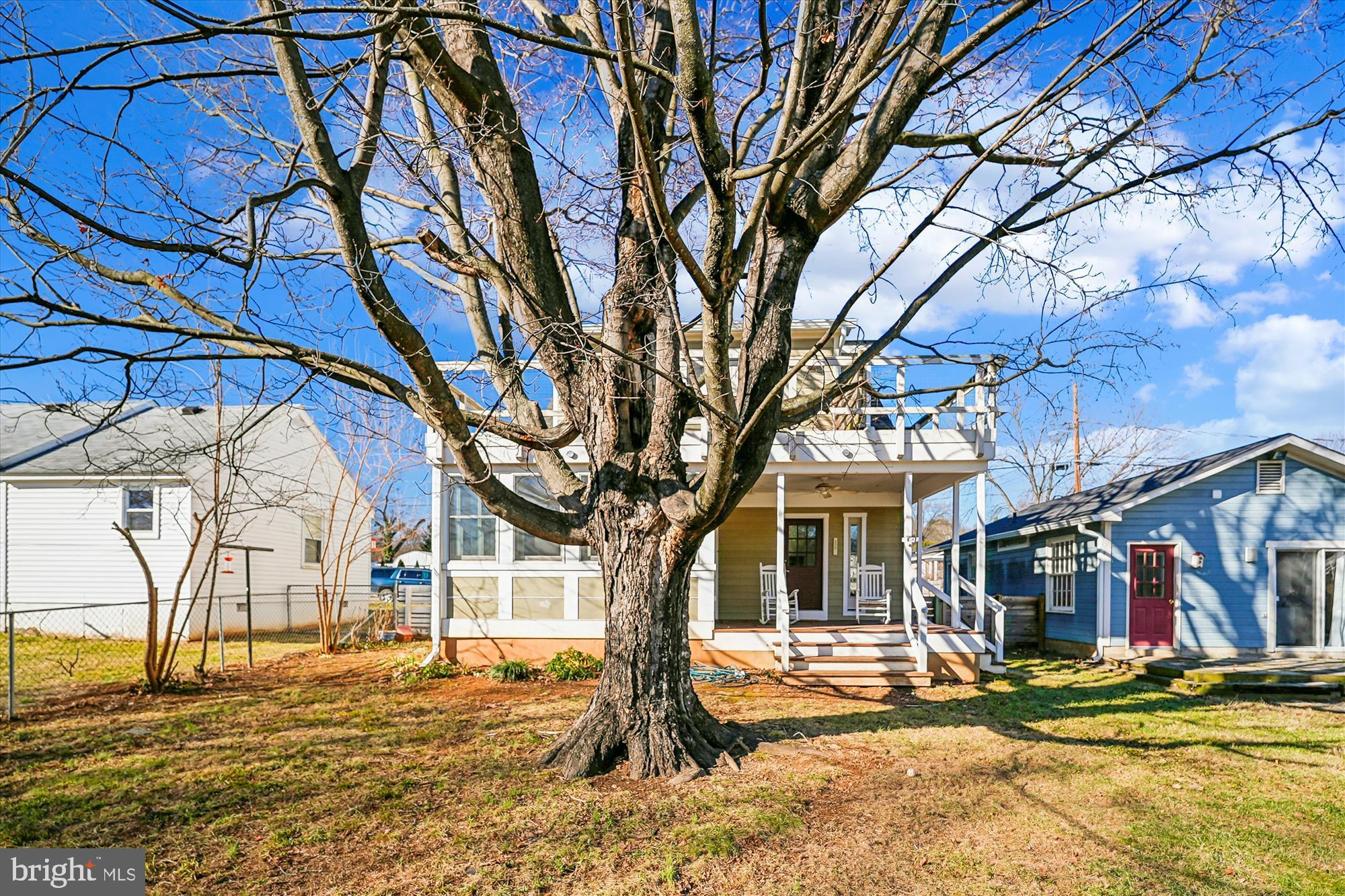 104 Pershing Avenue Northwest Leesburg, VA 20176 - Photo 3 of 36 a house with trees in front of it