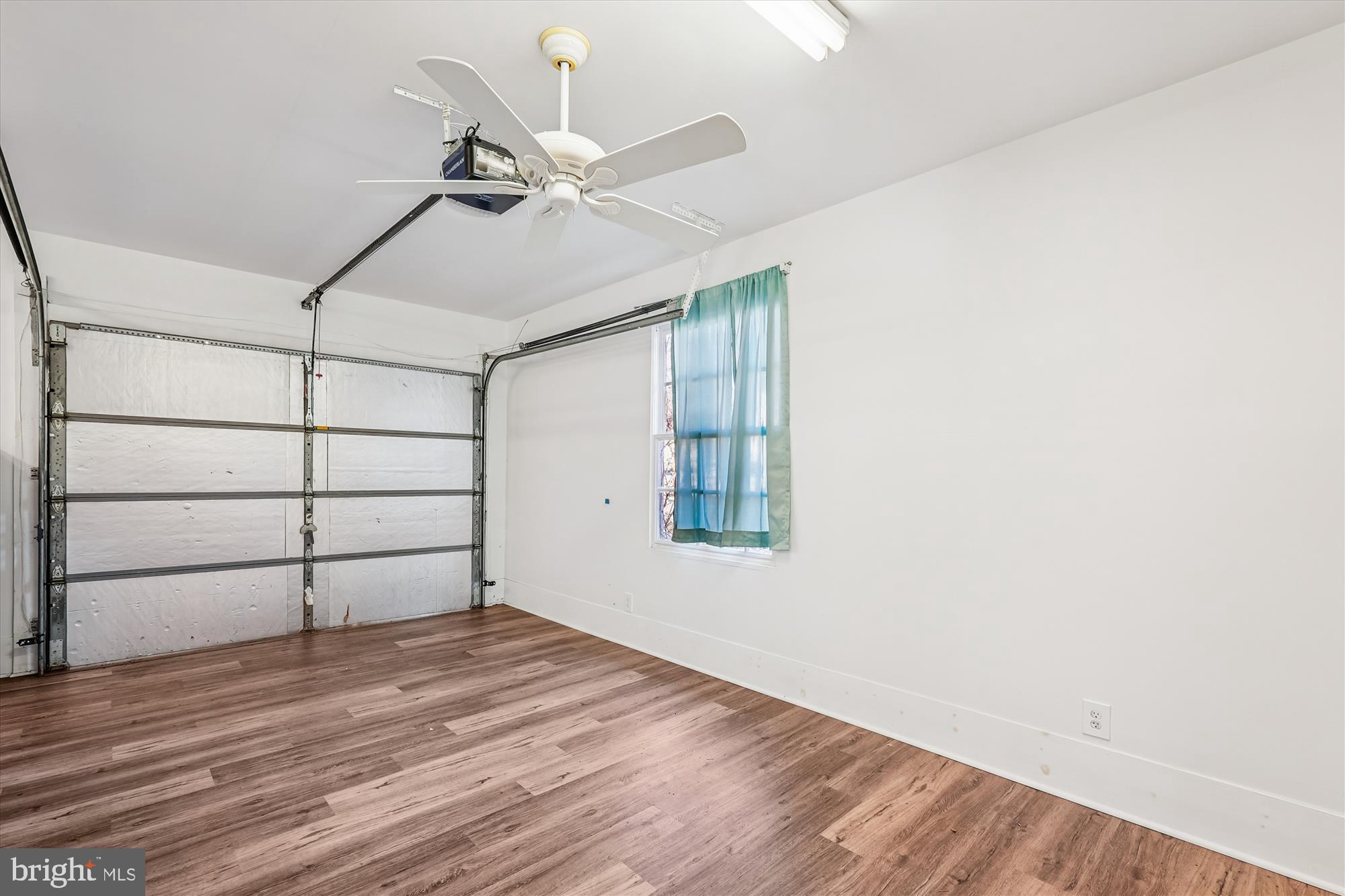 104 Pershing Avenue Northwest Leesburg, VA 20176 - Photo 31 of 36 an empty room with wooden floor and windows