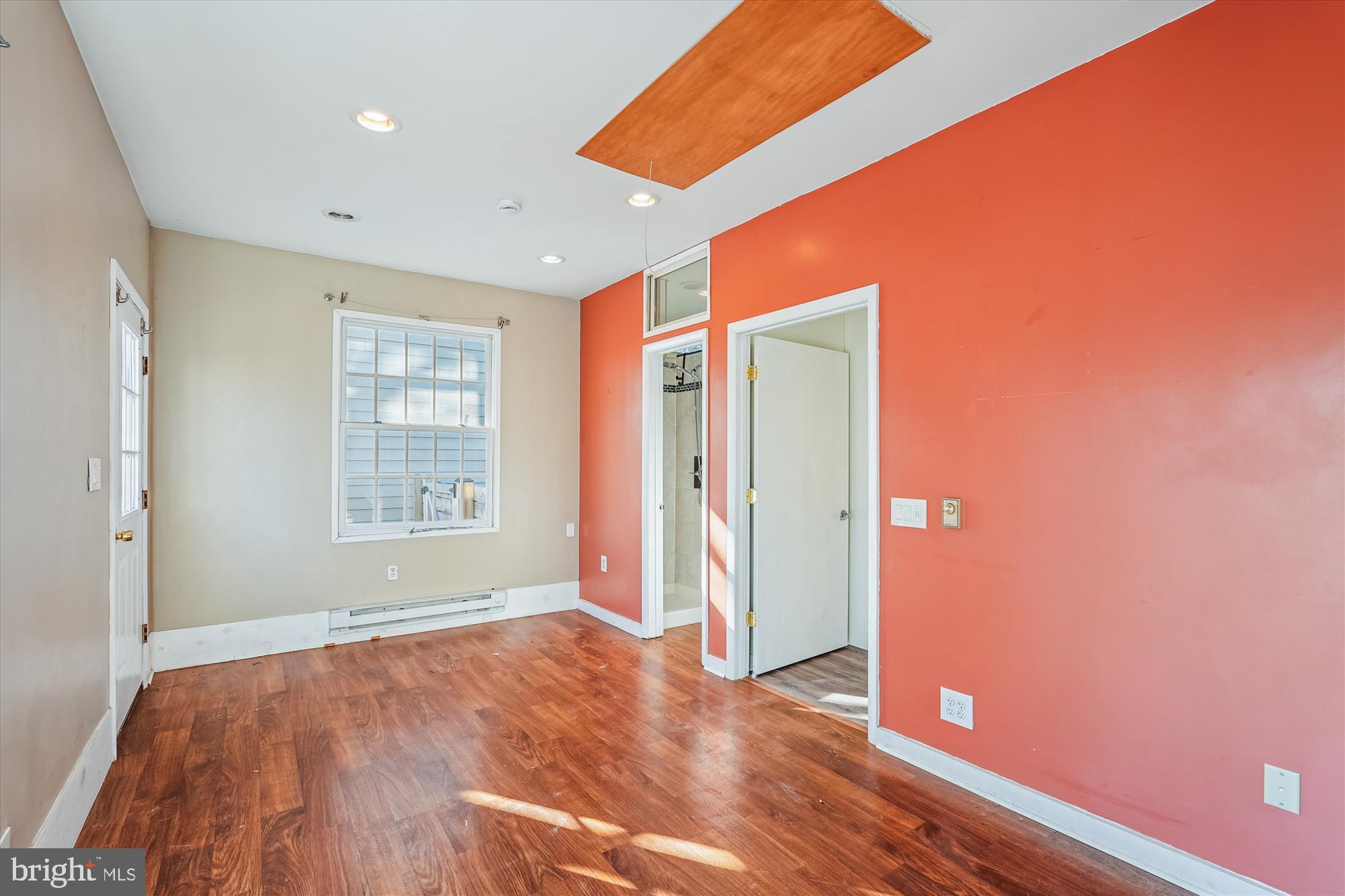 104 Pershing Avenue Northwest Leesburg, VA 20176 - Photo 33 of 36 an empty room with wooden floor and windows