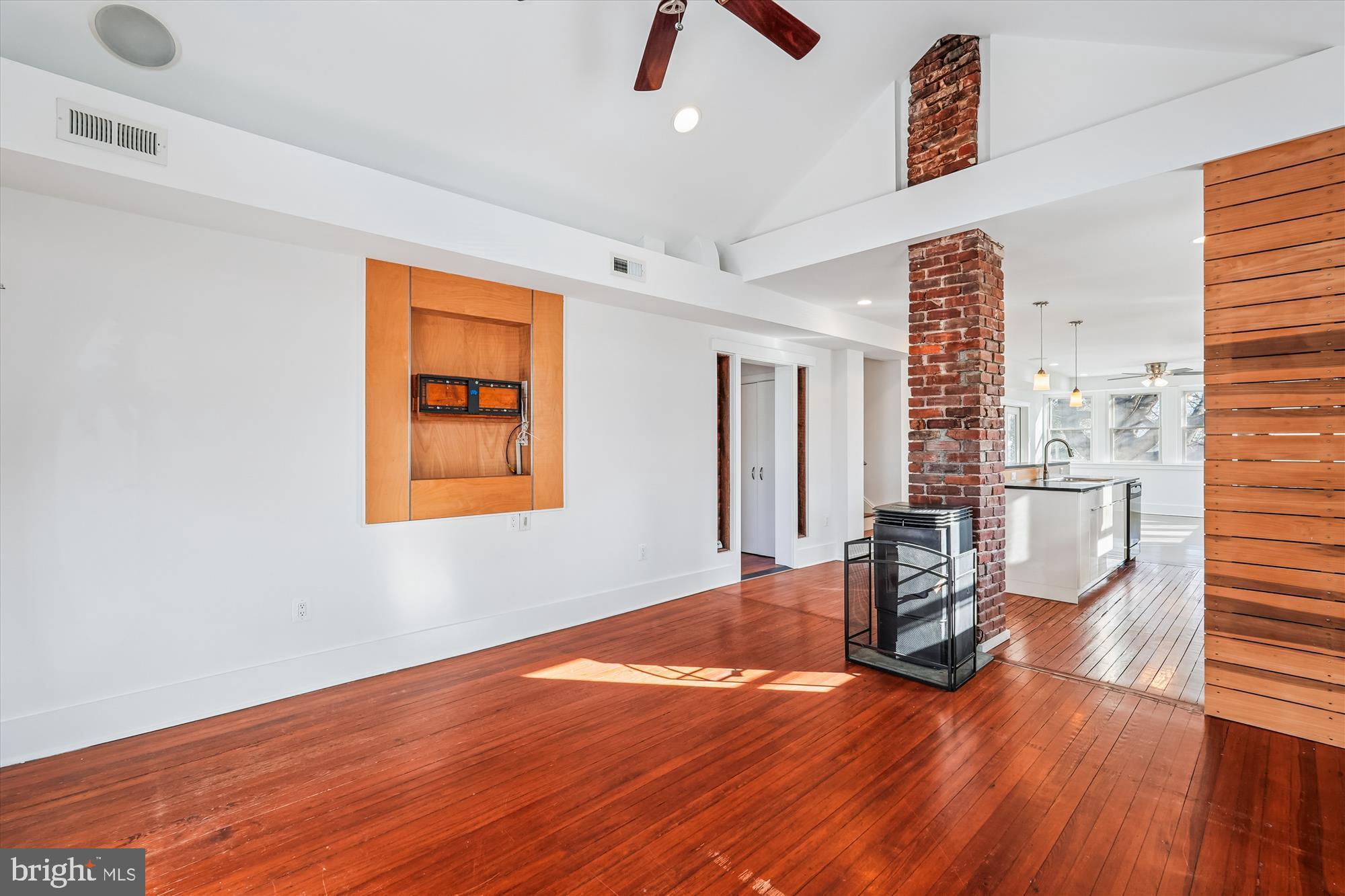 104 Pershing Avenue Northwest Leesburg, VA 20176 - Photo 6 of 36 a view of a livingroom with chair and window