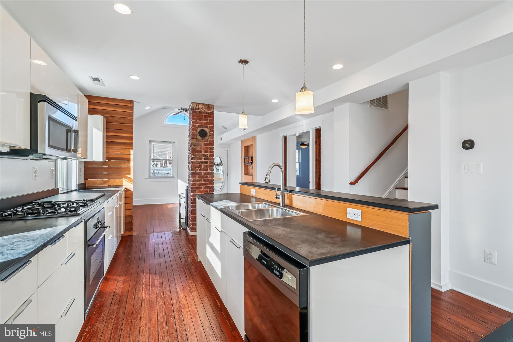 104 Pershing Avenue Northwest Leesburg, VA 20176 - Photo 9 of 36 a kitchen with granite countertop a stove and a sink