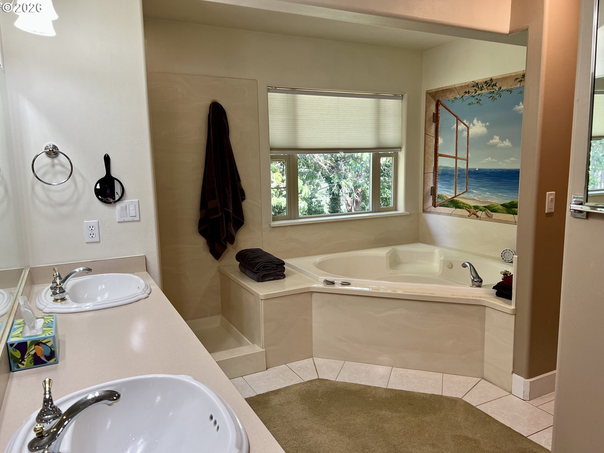 28544 Crow Road Eugene, OR 97402 - Photo 19 of 48 a bathroom with a tub sink and mirror