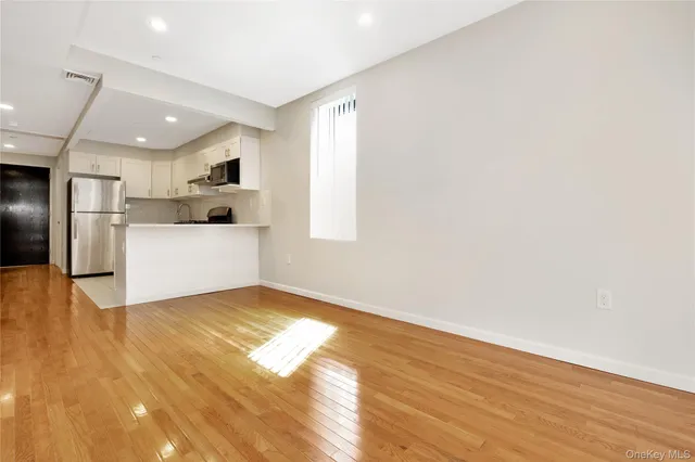 a view of a kitchen with a sink and cabinets