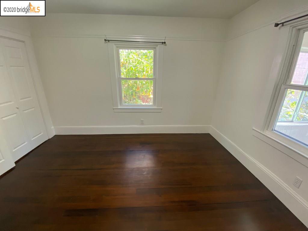 2124 Fifth Street Berkeley, CA 94710 - Photo 12 of 25 an empty room with wooden floor and windows