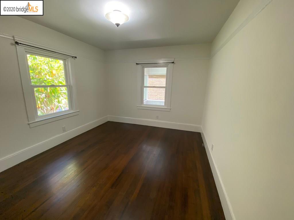2124 Fifth Street Berkeley, CA 94710 - Photo 13 of 25 an empty room with wooden floor and windows