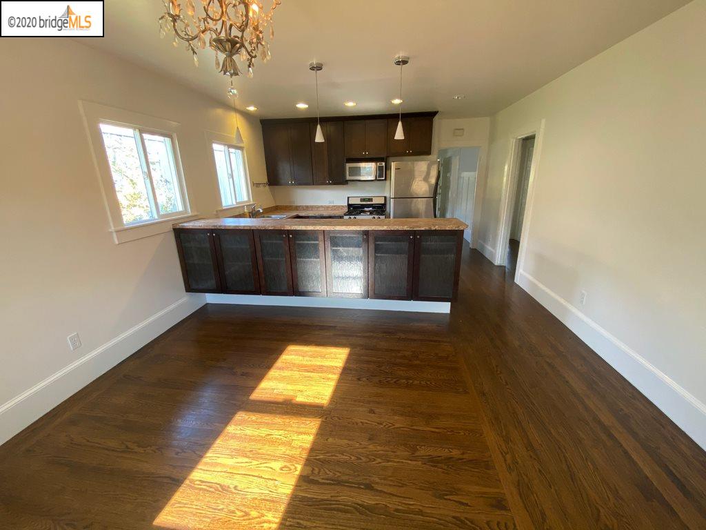 2124 Fifth Street Berkeley, CA 94710 - Photo 18 of 25 a view of kitchen cabinets and wooden floor