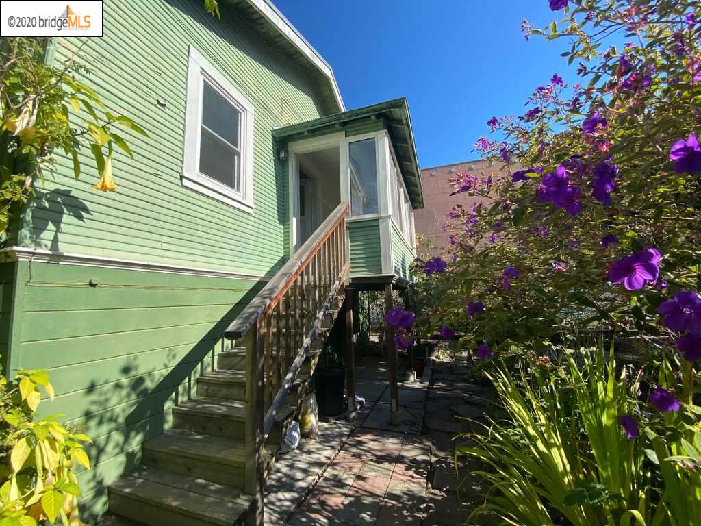 2124 Fifth Street Berkeley, CA 94710 - Photo 22 of 25 a front view of a house with a yard