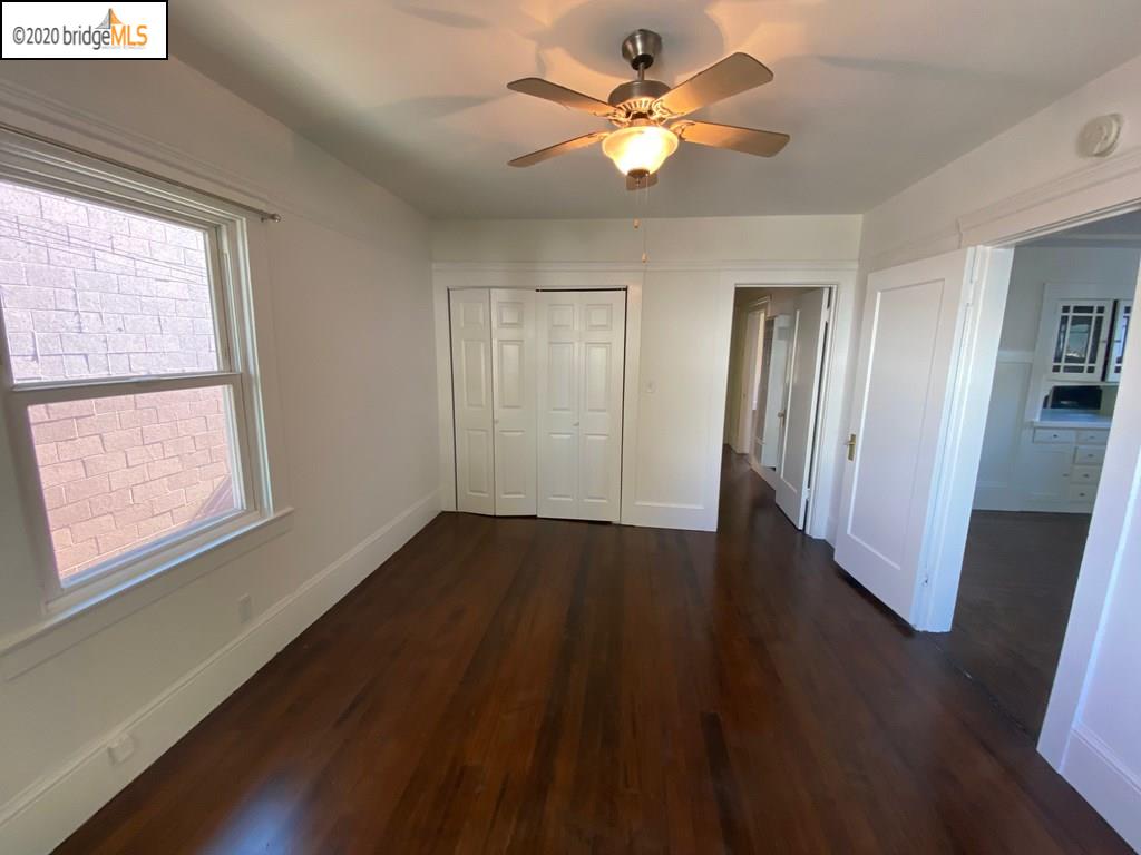 2124 Fifth Street Berkeley, CA 94710 - Photo 6 of 25 a view of an empty room with wooden floor and a window