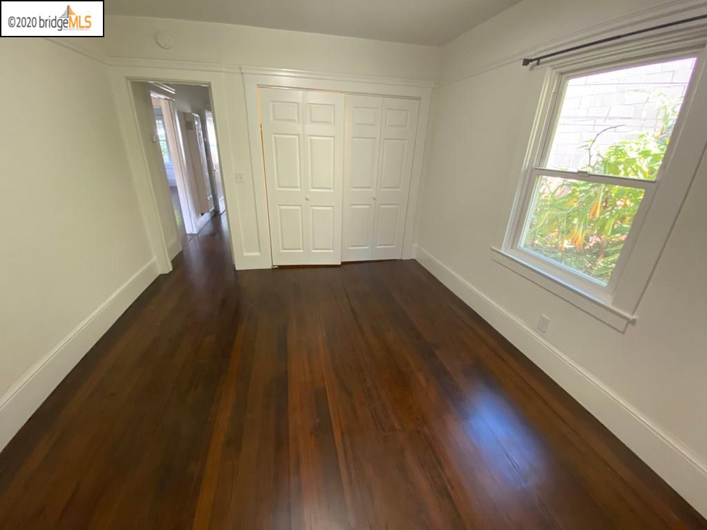 2124 Fifth Street Berkeley, CA 94710 - Photo 10 of 25 a view of an empty room with wooden floor and a window