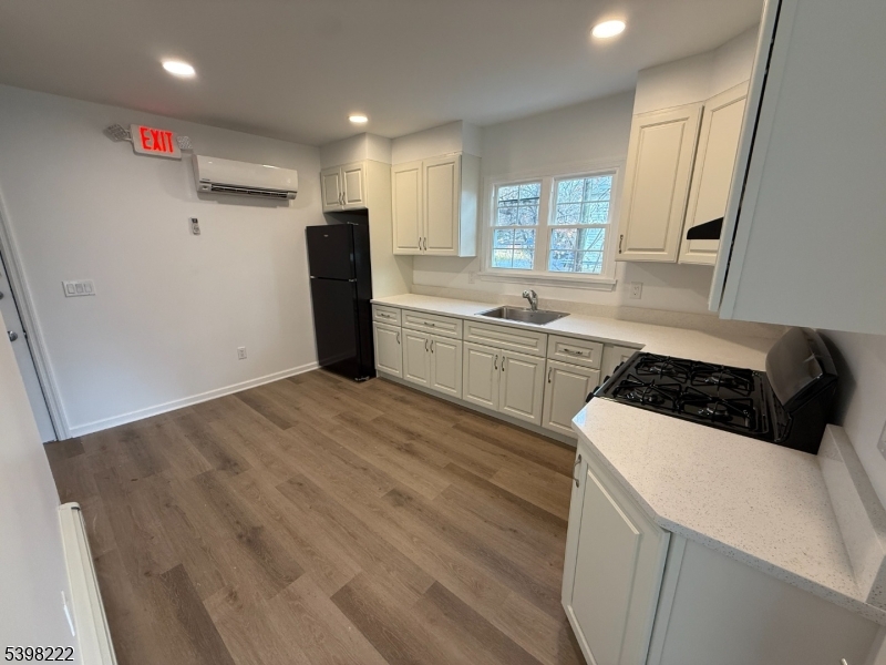 173 Highway 46, Unit 3 Mine Hill, NJ 07803 - Photo 3 of 11 a kitchen with a sink a stove and refrigerator