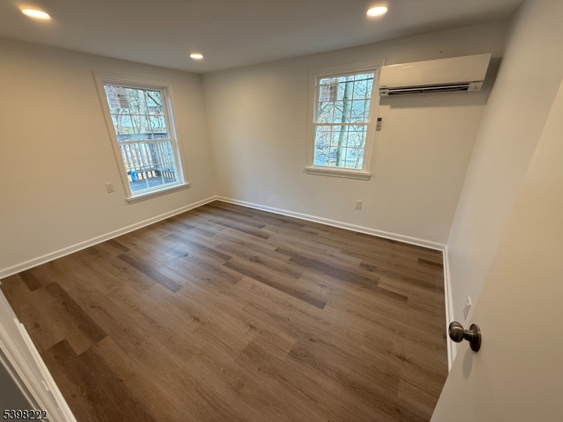 173 Highway 46, Unit 3 Mine Hill, NJ 07803 - Photo 8 of 11 an empty room with windows