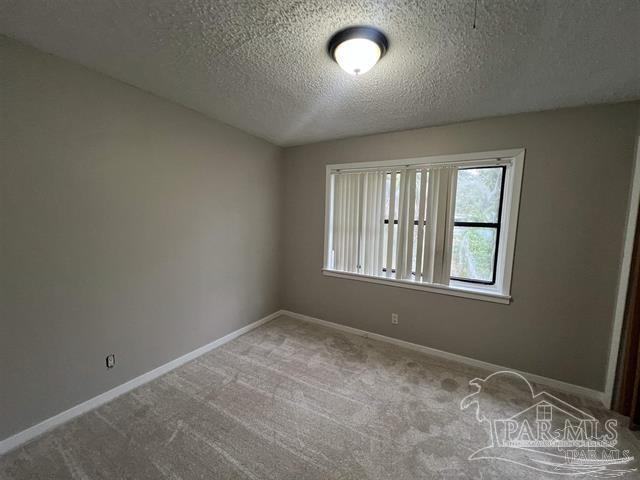 5733 Orange Street Milton, FL 32570 - Photo 17 of 32 an empty room with windows