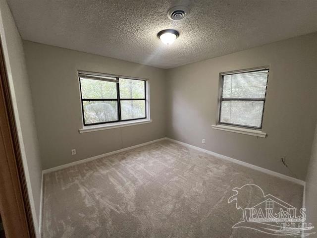 5733 Orange Street Milton, FL 32570 - Photo 2 of 32 an empty room with windows and closet