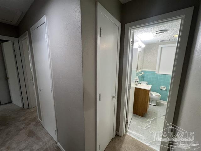 5733 Orange Street Milton, FL 32570 - Photo 24 of 32 a view of a bathroom from a hallway