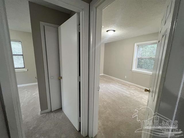 5733 Orange Street Milton, FL 32570 - Photo 25 of 32 a view of hallway with window