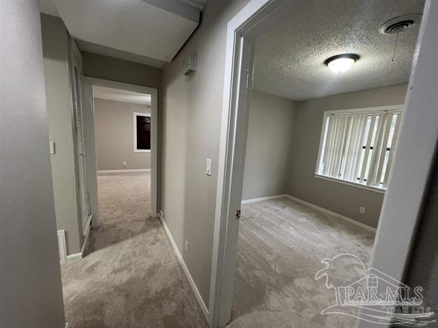 5733 Orange Street Milton, FL 32570 - Photo 26 of 32 a view of hallway with windows and cabinet
