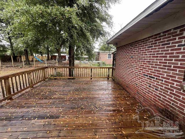 5733 Orange Street Milton, FL 32570 - Photo 29 of 32 a view of a pathway of a wooden deck