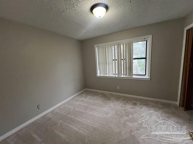 5733 Orange Street Milton, FL 32570 - Photo 5 of 32 a view of an empty room with a window