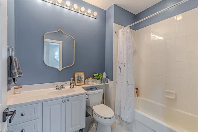 a bathroom with a double vanity sink mirror and a mirror