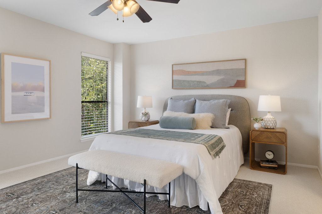 7812 Turquoise Trail Austin, TX 78749 - Photo 17 of 28 a bedroom with a bed and a chandelier