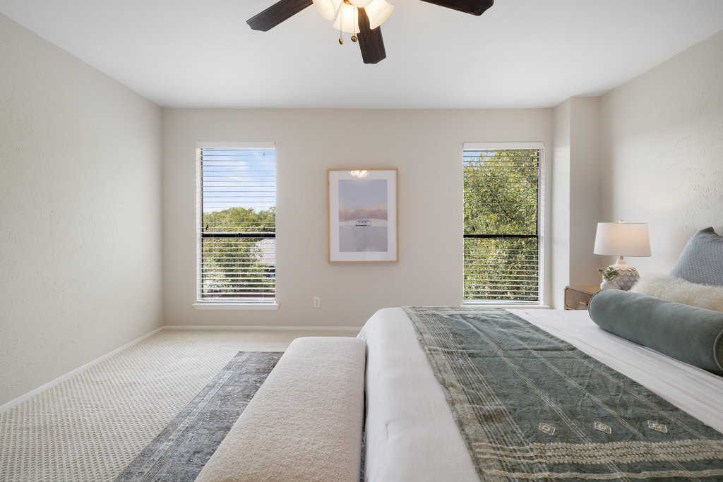 7812 Turquoise Trail Austin, TX 78749 - Photo 18 of 28 a bedroom with a large bed and a window