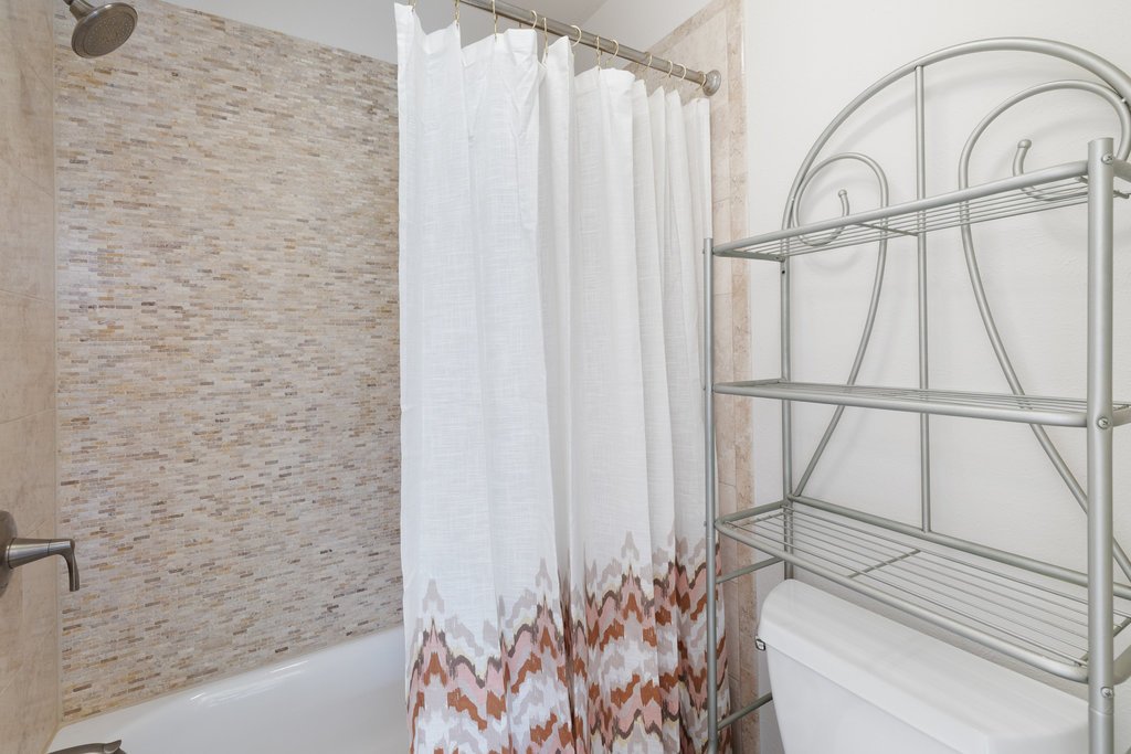 7812 Turquoise Trail Austin, TX 78749 - Photo 20 of 28 a bathroom with a bathtub and shower