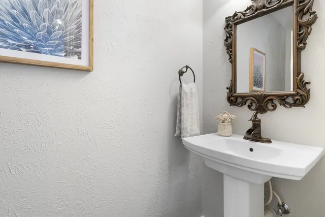 a view of a table and chairs under an umbrella