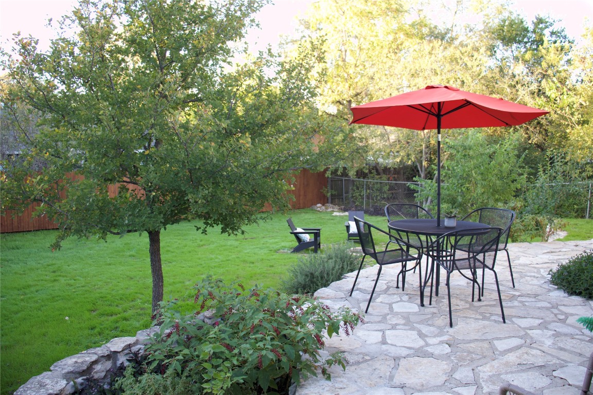 7812 Turquoise Trail Austin, TX 78749 - Photo 27 of 28 a view of a table and chairs under an umbrella