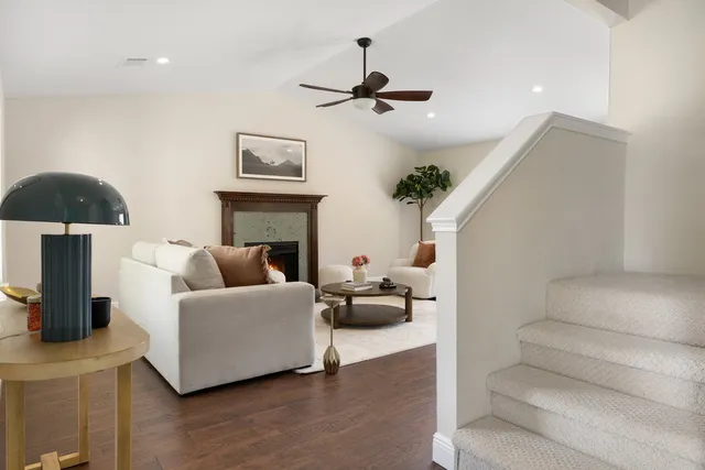 a living room with furniture and a fireplace