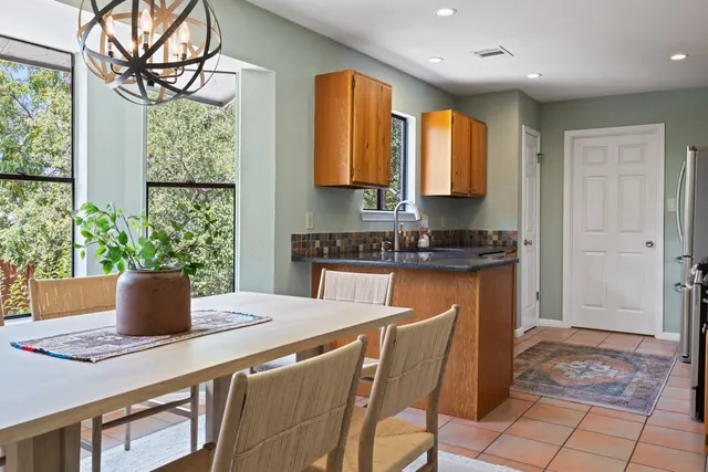 a view of a dining room with furniture window and outside view