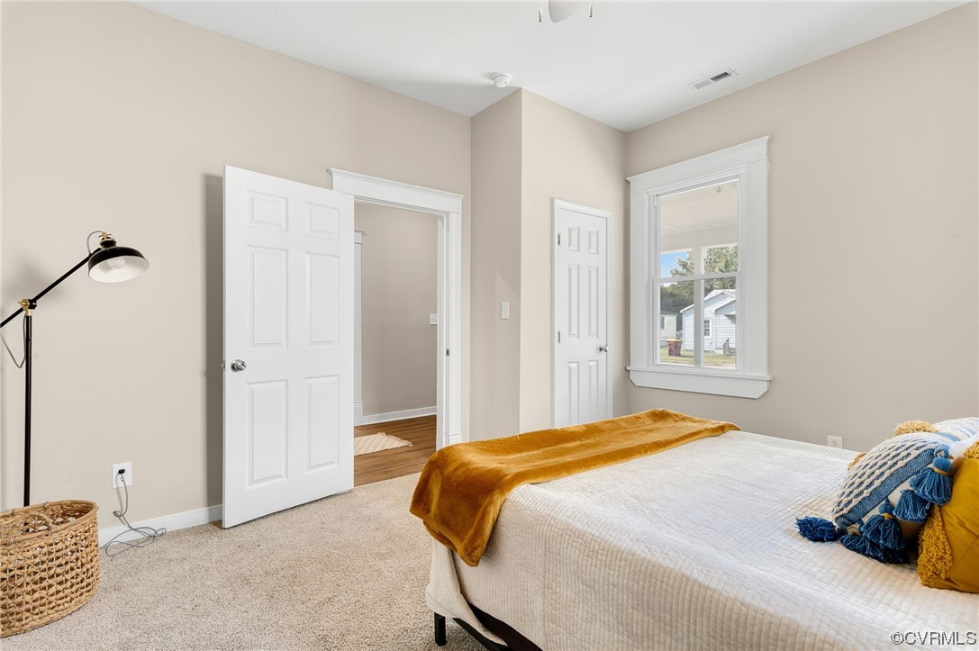 117 Spring Street Petersburg, VA 23803 - Photo 11 of 22 a bedroom with a bed and a window